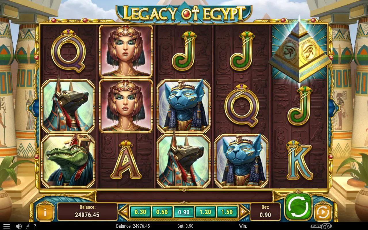 Base grid with a stacked Cleopatra column on the second reel and a single bright pyramid scatter glowing on the rightmost reel